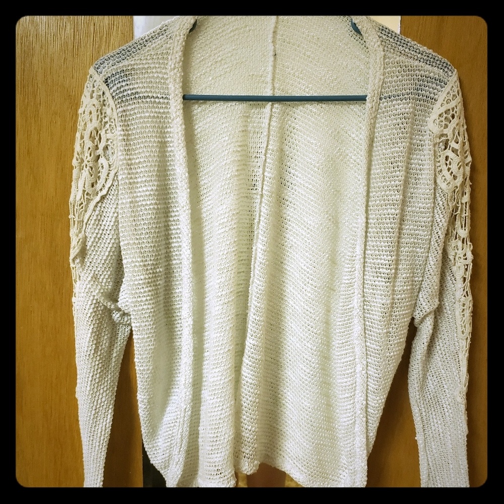 White cream cardigan with cutouts on the arm